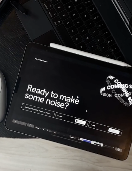 Tablet displaying 'Ready to make some noise?' on desk